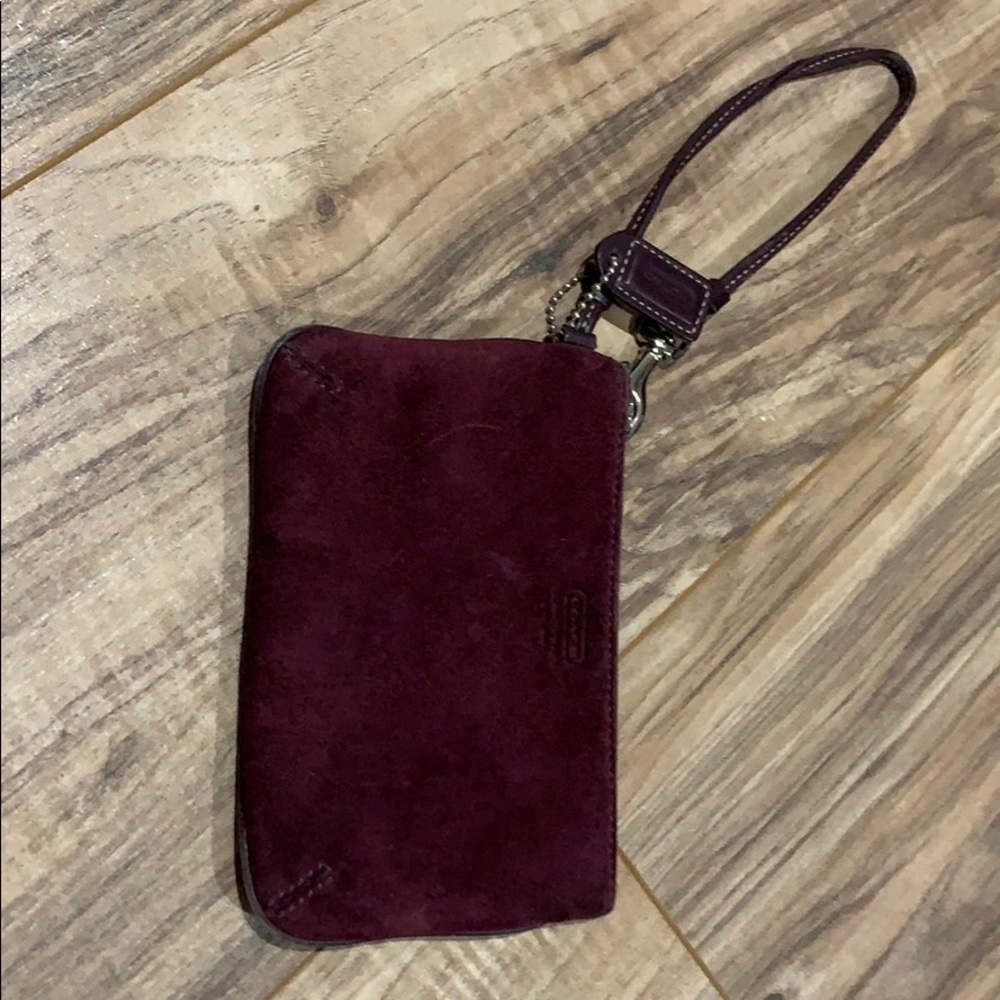 women’s marooning wine colored coach wristlet